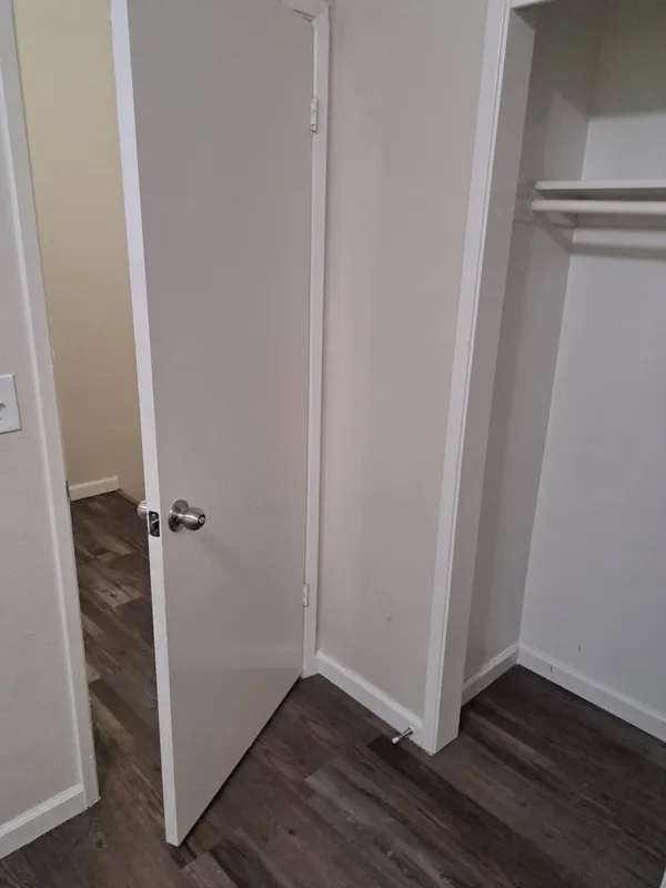 Empty closet with the door open