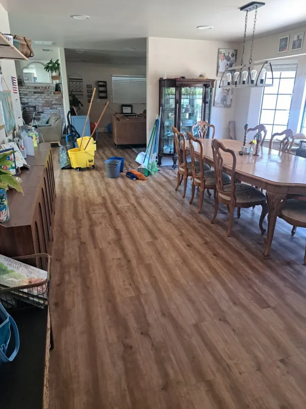 Dining room with a mop bucket during a cleaning job