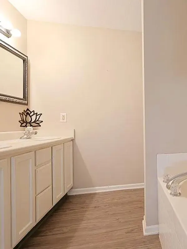 Bathroom with a double vanity and a garden tub